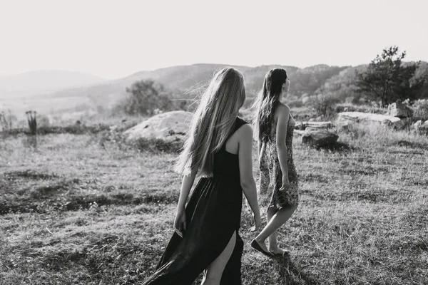 beautiful girls walking in mountains