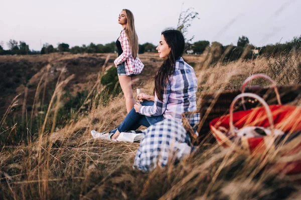 Beautiful girls on picnic in mountains — Stock Photo, Image