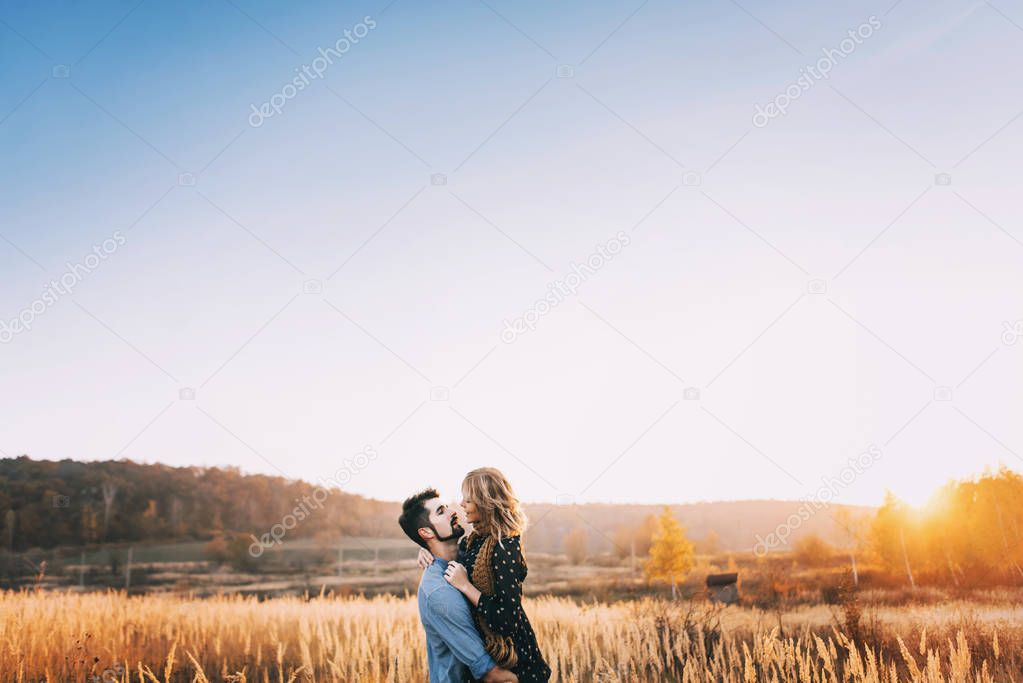 Couple embracing in wheat field