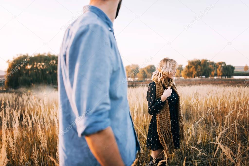 Couple embracing in wheat field