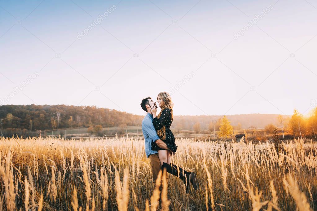 Couple embracing in wheat field