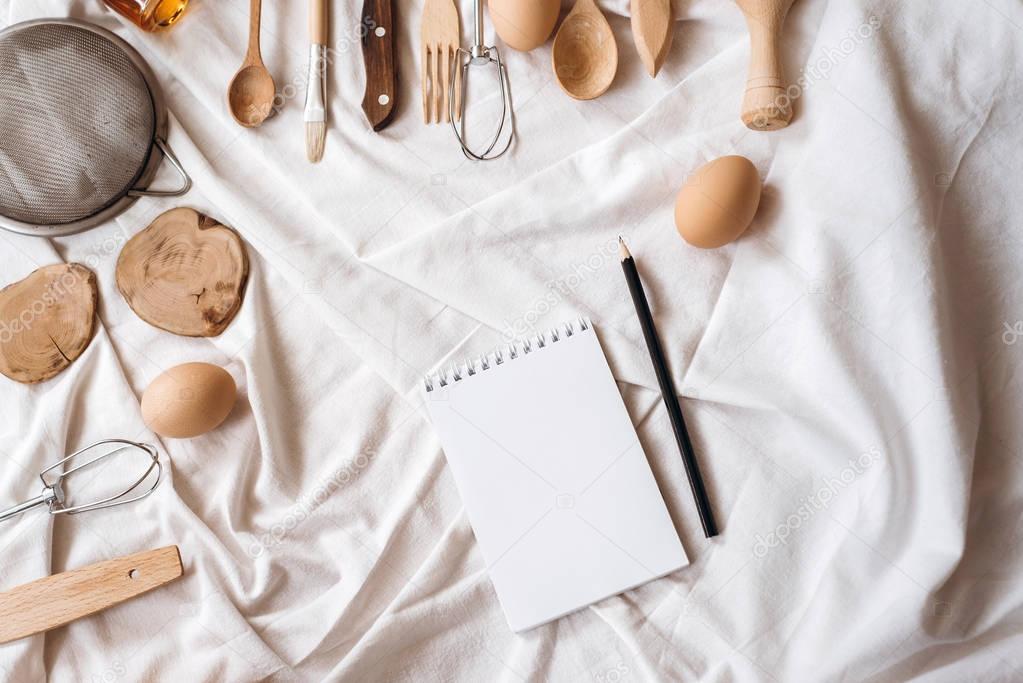 kitchen ware on white blanket 