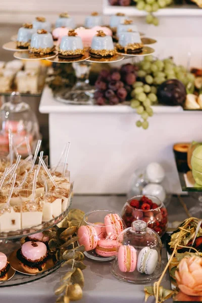 Wedding sweet table with desserts and cakes. A beautiful wedding reception