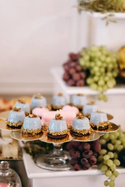 Wedding sweet table with desserts and cakes. A beautiful wedding reception