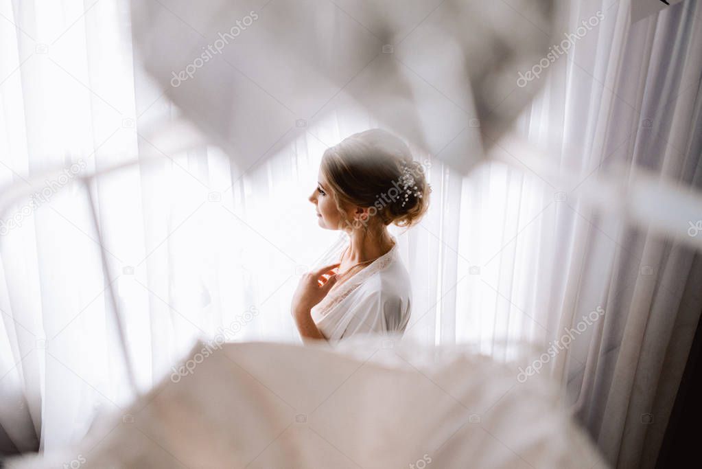 Portrait of beautiful young woman getting ready for her wedding 