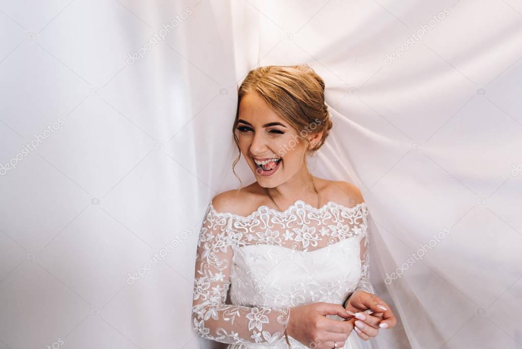 Portrait gorgeous young bride in elegant dress posing 