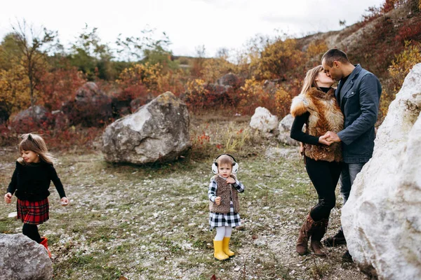 Man Kissing Woman While Small Girls Walking — Stock Photo, Image