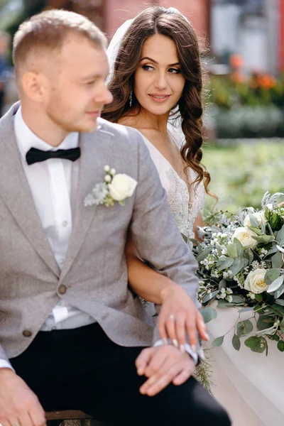 Closeup Lovely Newlyweds Holding Hands Sitting Bench Garden — Stock Photo, Image