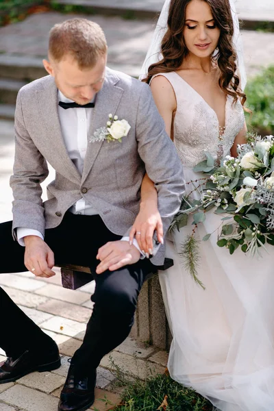 Closeup Lovely Newlyweds Holding Hands Sitting Bench Garden — Stock Photo, Image