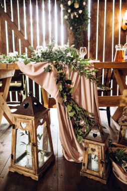 Festive dining room in rustic style decorated  with white flowers