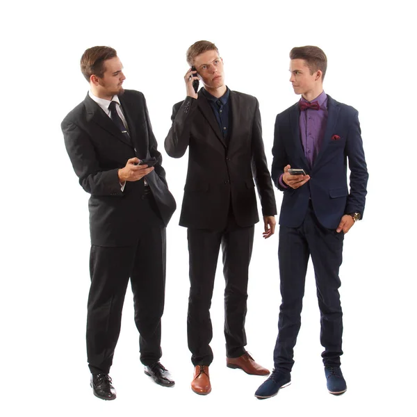 Três homens de negócios em seus telefones — Fotografia de Stock
