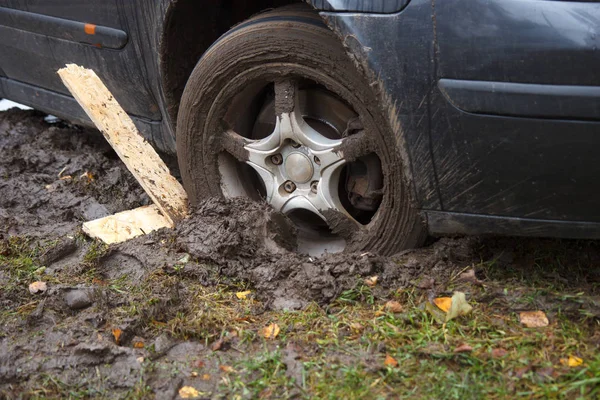 Car wheel in dirt — Stock Photo, Image