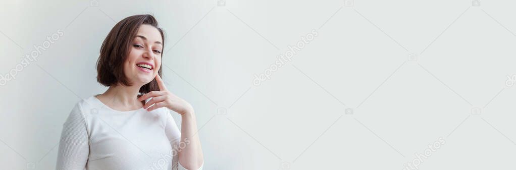 Happy girl smiling. Beauty portrait young happy positive laughing brunette woman on white background isolated. European woman. Positive human emotion facial expression body language. Banner