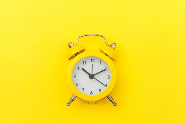 Ringing twin bell vintage classic alarm clock Isolated on yellow colourful trendy modern background. Rest hours time of life good morning night wake up awake concept. Flat lay top view copy space. — Stock Photo, Image