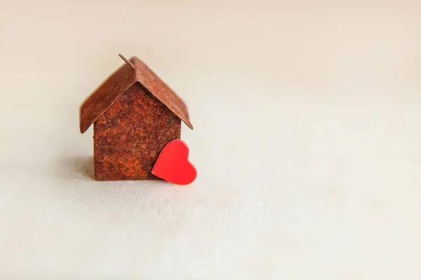 Miniature toy model house with red heart on wooden backdrop. Eco Village abstract environmental background. Real estate mortgage property insurance sweet dream home ecology concept — Stock Photo, Image