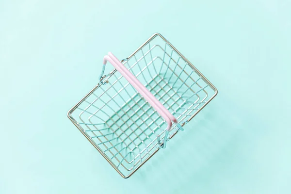 Small Empty Supermarket Grocery Shopping Basket Toy Isolated Blue Pastel — Stock Photo, Image