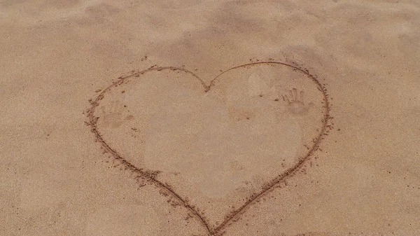 heart drawing on the sand