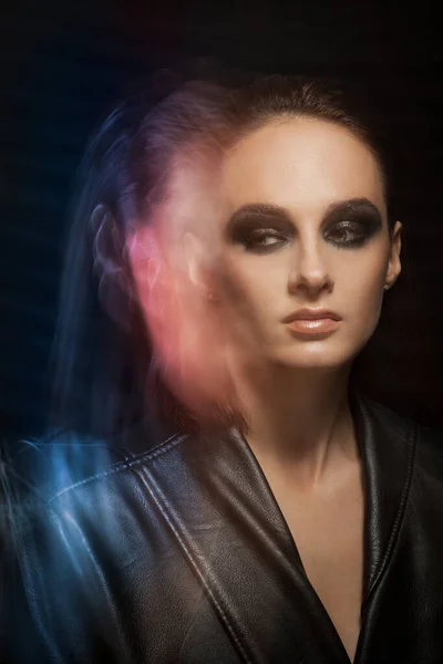 Closeup portrait of a serious lady with smoky eye makeup — Stock Photo, Image