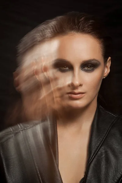 Closeup portrait of a serious lady with smoky eye makeup — Stock Photo, Image