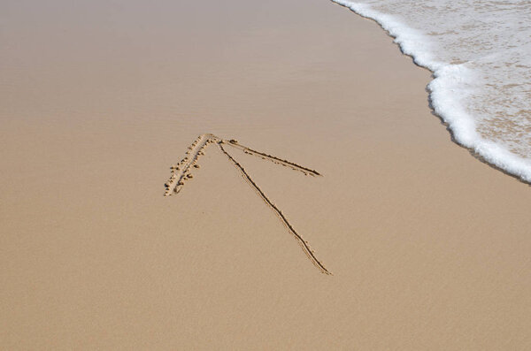 Arrow written in the sand