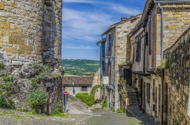 Street of Cordes sur ciel and French countryside clipart