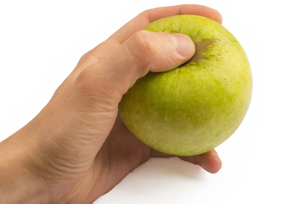 Em uma mão uma maçã verde isolada em um fundo branco — Fotografia de Stock