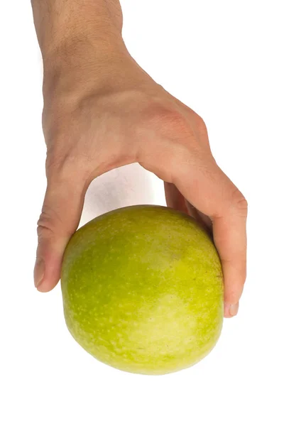 I en hand ett grönt äpple isolerad på en vit bakgrund — Stockfoto