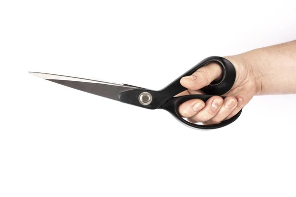 Hand holding a black scissor in a white background — Stock Photo, Image