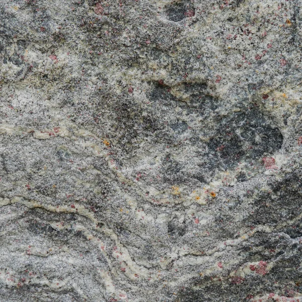 Gray texture of a stone with pink spots. — Stock Photo, Image