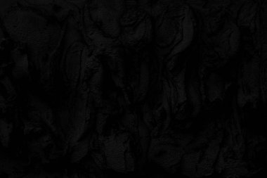 Soyut siyah arkaplan. Siyah sıva dokusu. Karanlık, kaba bir yüzey. Mimari kaplama çimentodan yapılmıştır..