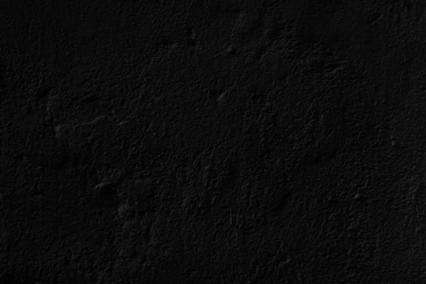 Abstract black background. Black stucco texture. Dark rough surface.