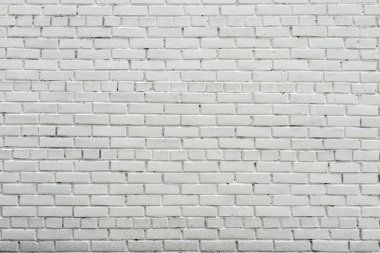 Eski bir evin beyaz duvarı. Tuğla duvar dokusu. Beyaz soyut arkaplan.