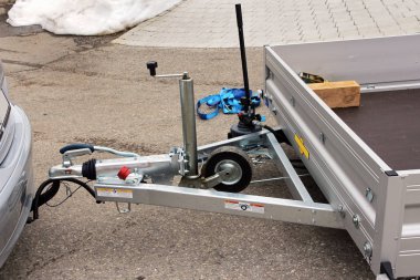 Trailer hitch with trailer on a car clipart