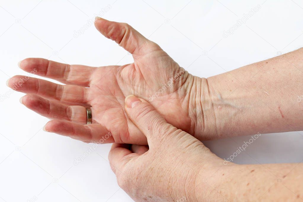 An elderly woman has pain in her hands