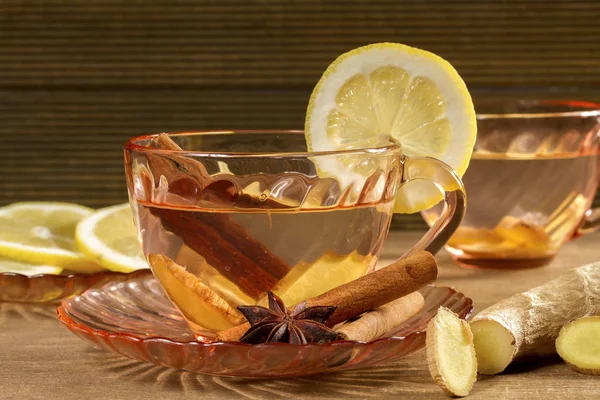 A cup of ginger tea with lemon, cinnamon and anise stars. Ginger — Stock Photo, Image