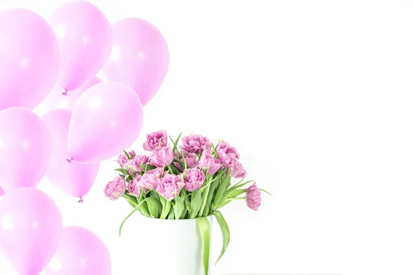 Bouquet of pink tulips in bucket with lot pink air balloons. Fresh spring easter flower. White background , copy space. Greeting card — Stock Photo, Image