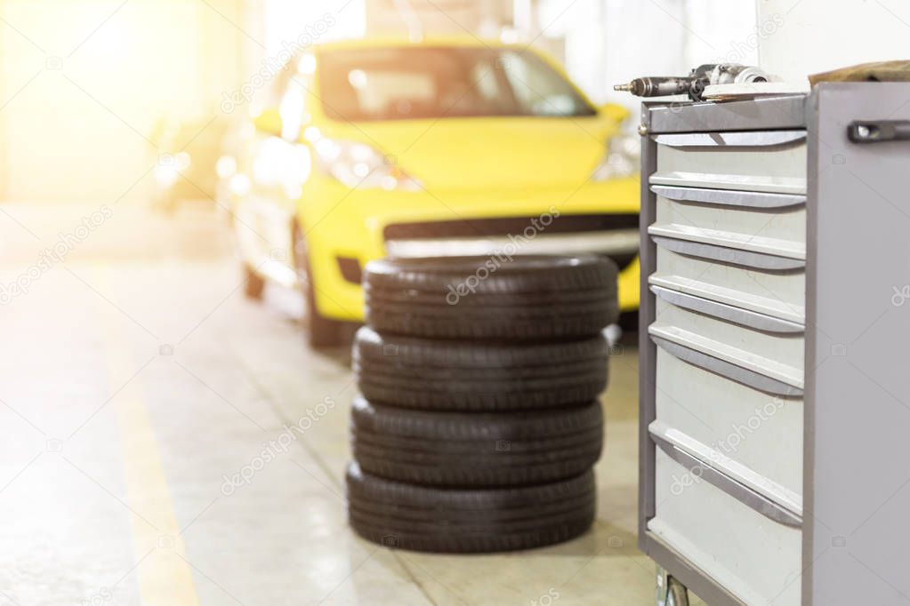 Car maintenance and service center. Vehicle tire  repair and replacement equipment.  Seasonal tire change