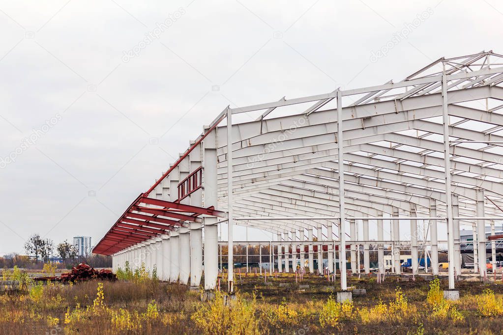  Construction site. Metal structure frame of industrial building 