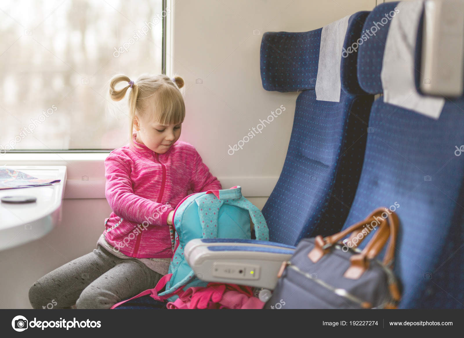 Little Girl Travel By Train Kid Sitting In Comfortable