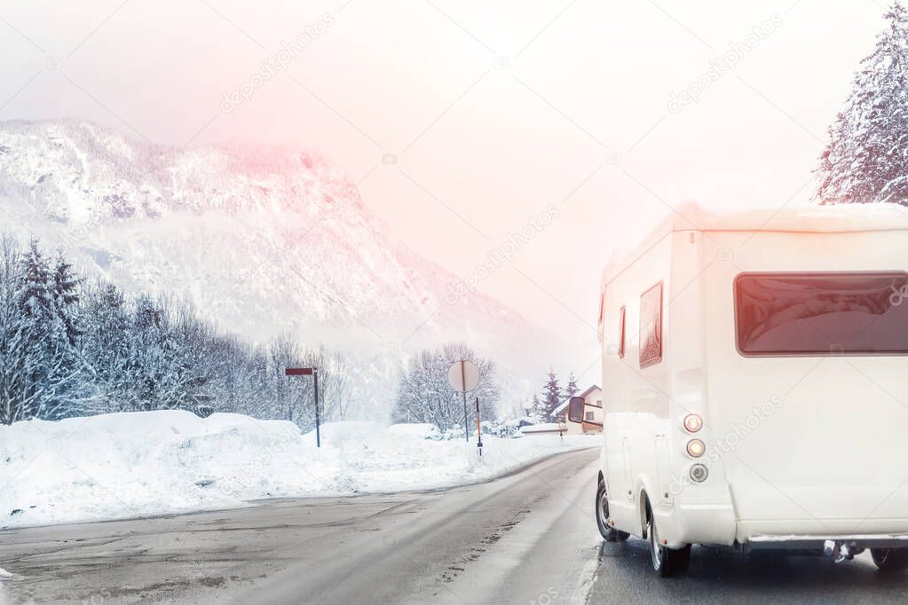 Caravan or campervan turning from road with beautiful mountain a