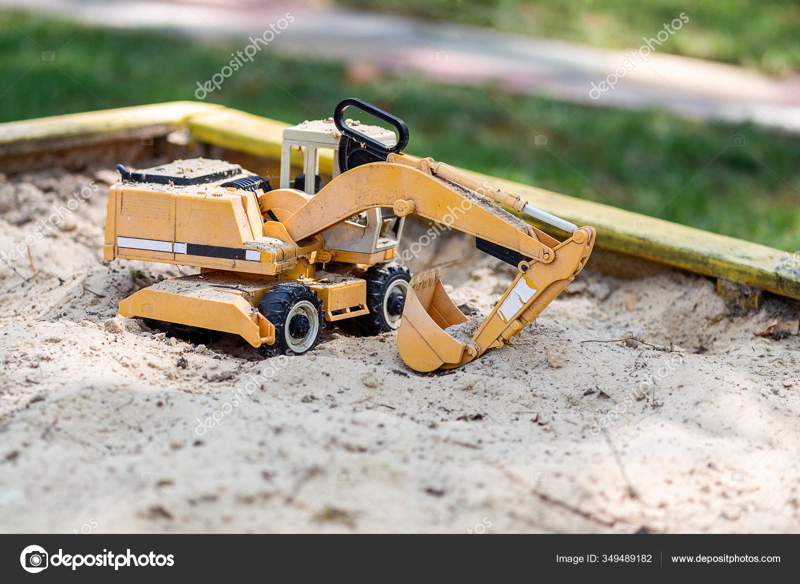 sandbox with excavator