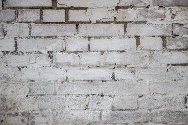 Soyut yıpranmış doku lekeli eski sıva açık gri ve kırsal odada yaşlı boya beyaz tuğla duvar arka plan, taş işçiliği teknolojisi renk yatay mimari grungy paslı bloklar