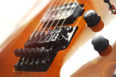 Electric guitar close-up with soft focus of brown color, Floyd Rose clipart