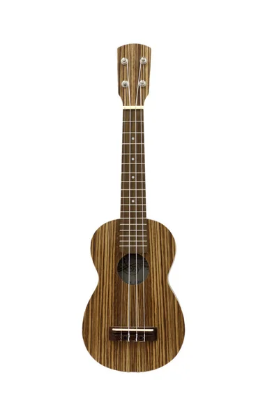 Ukulele di legno su sfondo bianco parete, isolare — Foto Stock