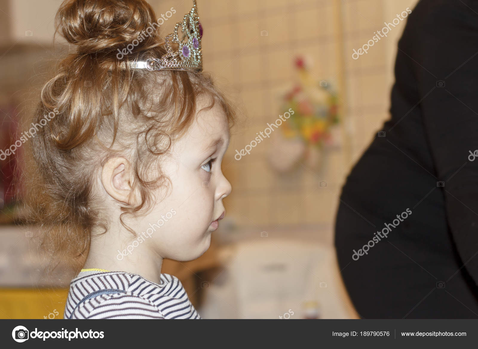 Portrait Of Joyful Little Girl With Cake At Birthday Party