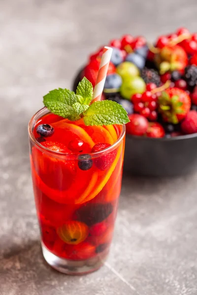 A refreshing drink made from fresh summer berries with lemon and mint. — Stock Photo, Image