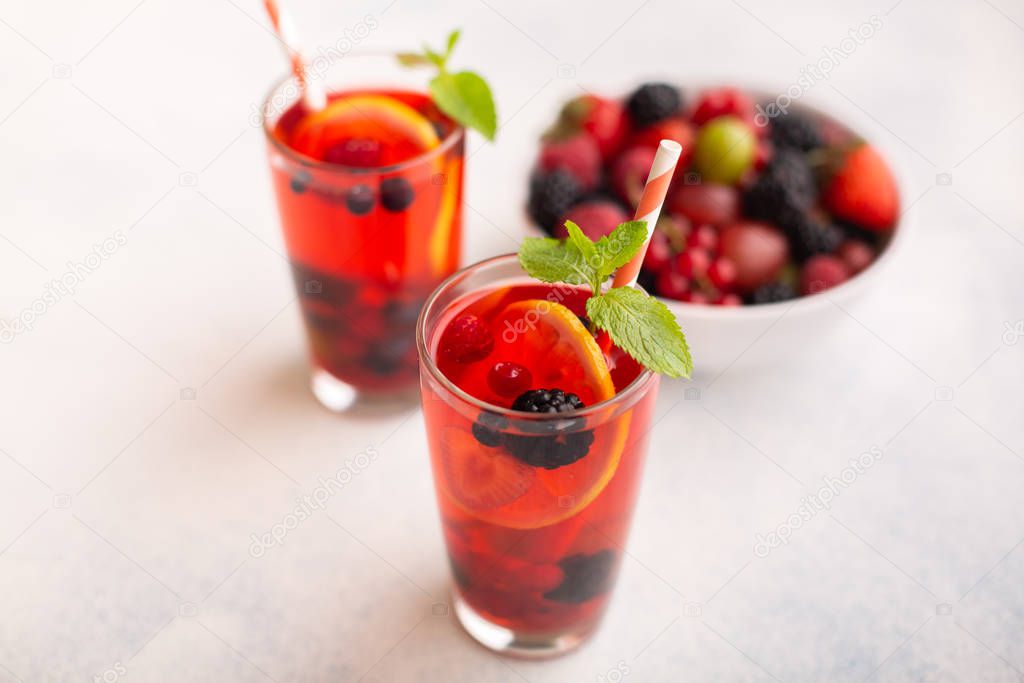 Fresh summer berry drink with lemon and mint.