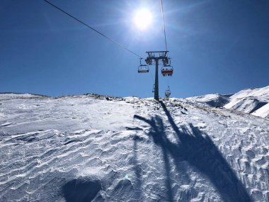 Ski lift in the ski resort of Erciyes, Turkey.  clipart