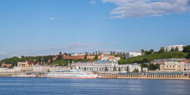 Motor ships near the berths in Nizhny Novgorod against the backg clipart