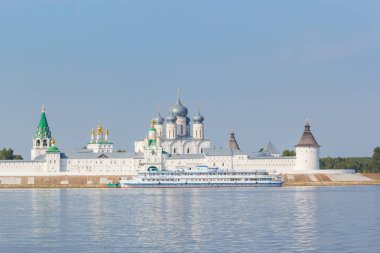 Pier with a motor ship near the walls of the monastery in Makar'